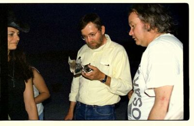 Harry and Donald contemplate the schrapnel, Gwen looks on amused. Harry's expression says it all.