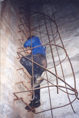 The climb back to the surface, up a ladder up to a former lookout point. Since the complex was buried, the lookout point at the top of this shaft is now buried under several feet of dirt and concrete.